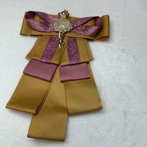 Yellow and pink brooch